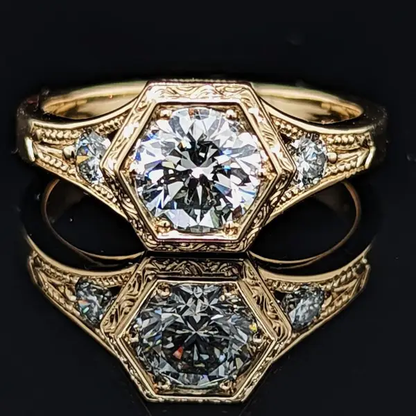 “MODERN HEIRLOOM® Deco hexagon diamond ring in 14K yellow gold with hand-engraved details, designed by Ben Stewart and Kathryn Holton Stewart.”