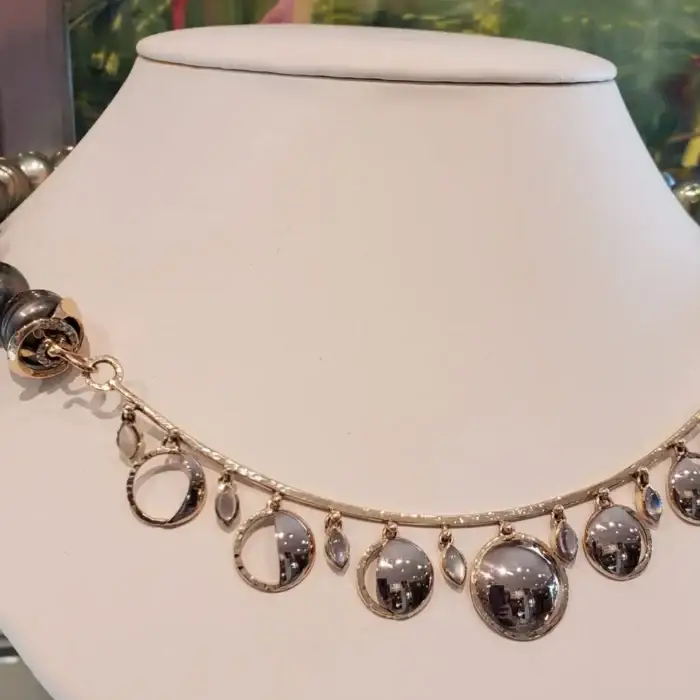 Crafted in 18 K Palladium White Gols and Featuring Tahitian Pearls , Marquise Moonstones, and the phases of the moon